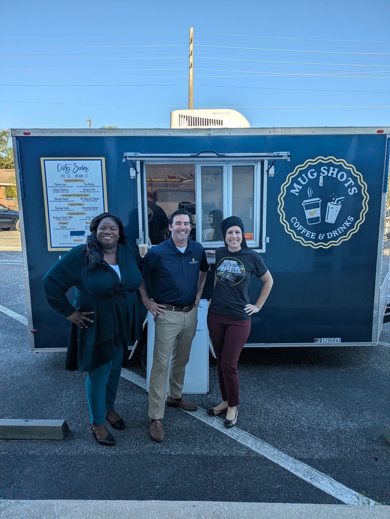 Dr. Weber, Dr. Carty and Mr. McCarthy standing in front of Mug Shots Coffee Truck. 