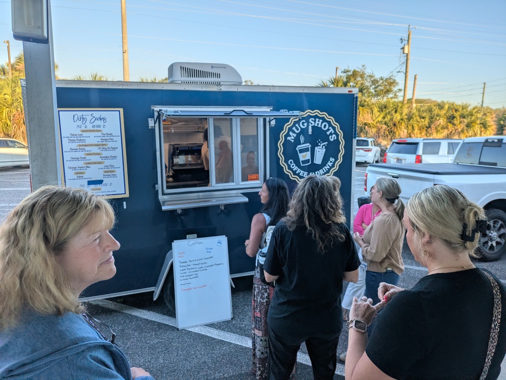 Group of teachers waiting in line at the coffee truck.