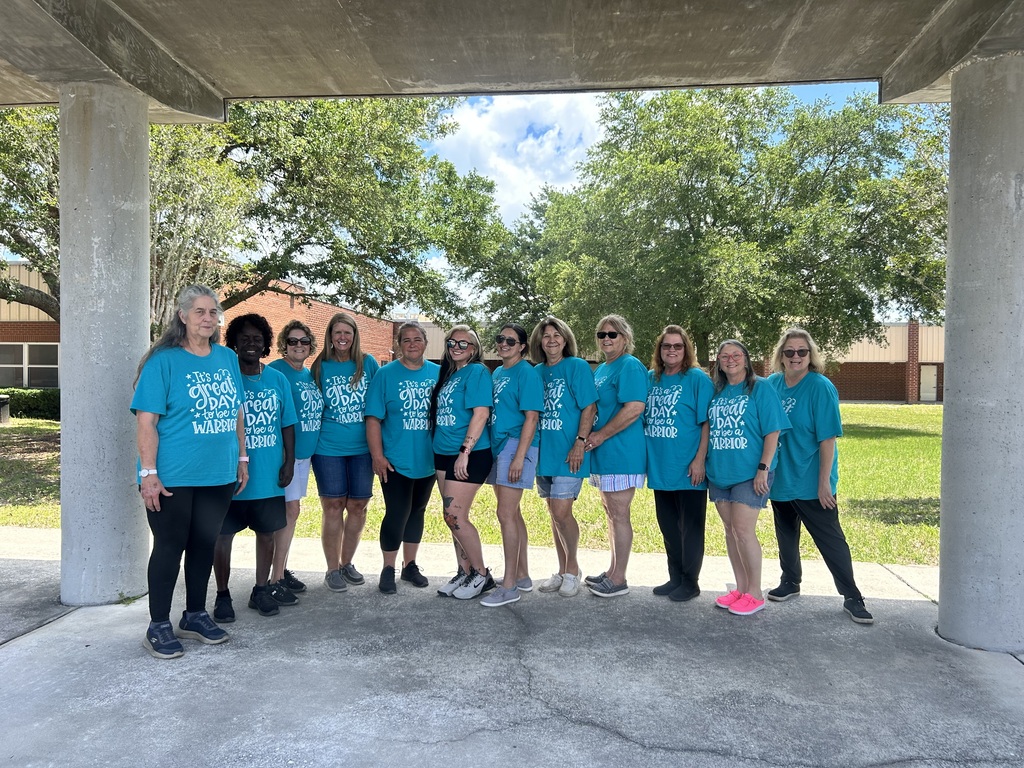 Picture of bus drivers wearing matching shirts