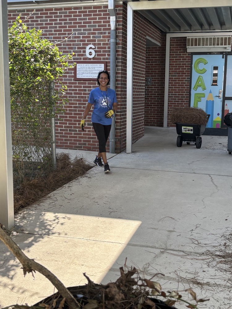 Mrs. White working hard to help beautify the campus.