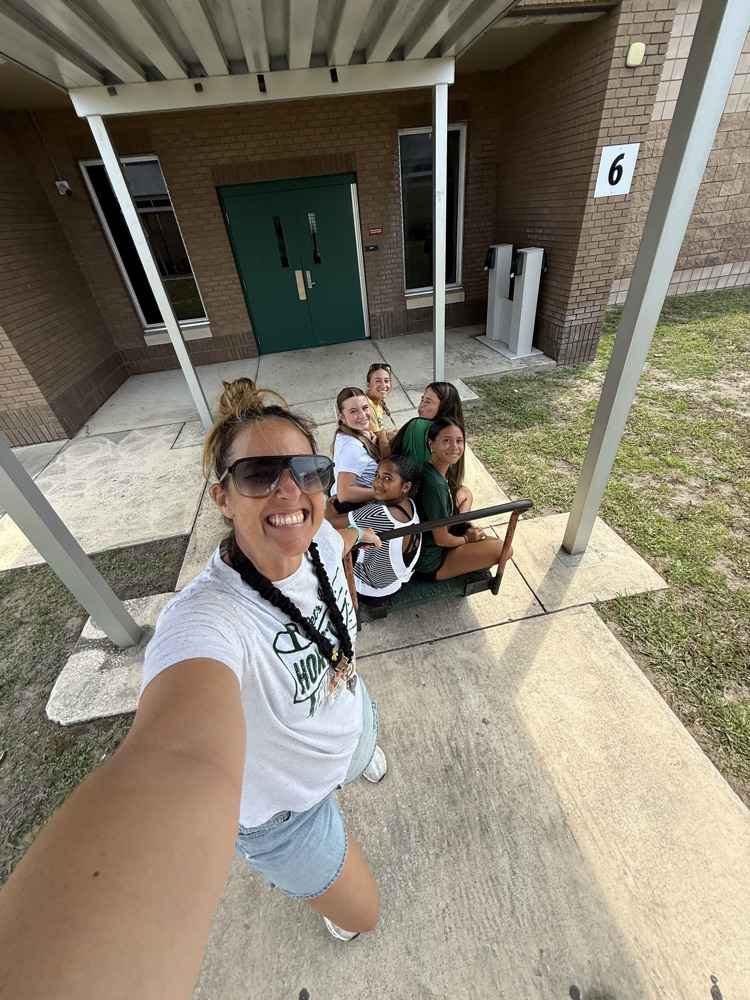 students helping move textbooks