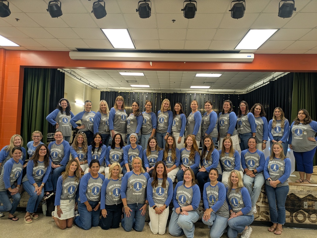 The Southside Elementary faculty gathers for a group photo on stage, wearing matching school spirit shirts as they kick off the 2026–2027 school year together.