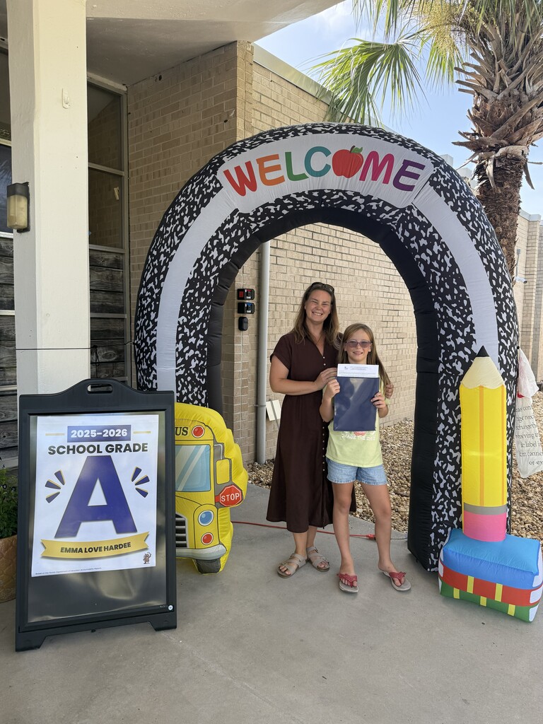 Family posing for photo for meet and greet the teacher at E.L.H.