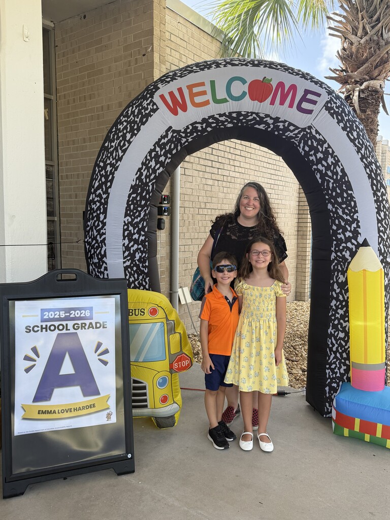 Family posing for photo for meet and greet the teacher at E.L.H.