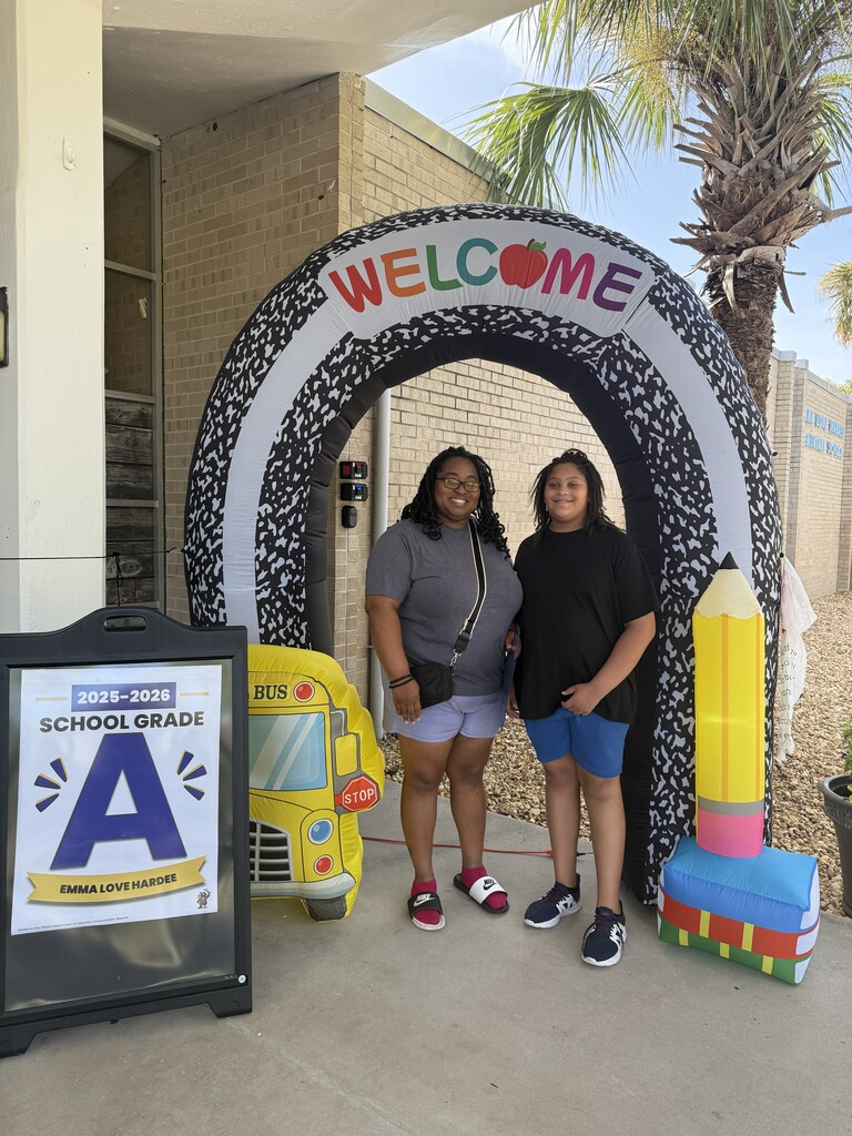 Family posing for photo for meet and greet the teacher at E.L.H.