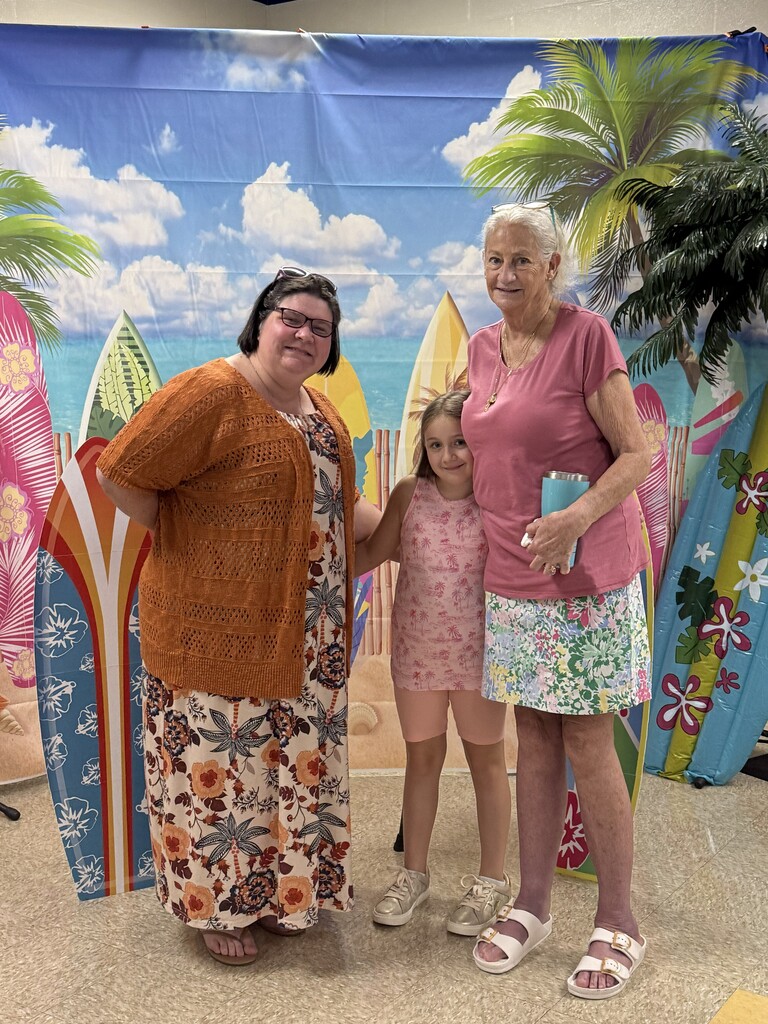 Family posing for photo for meet and greet the teacher at E.L.H.