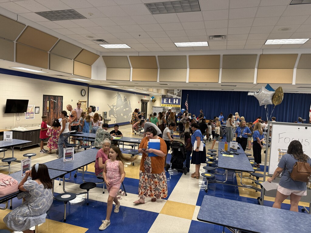 Family posing for photo for meet and greet the teacher at E.L.H.