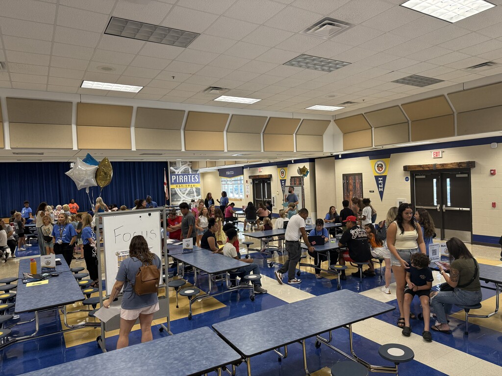 Family posing for photo for meet and greet the teacher at E.L.H.