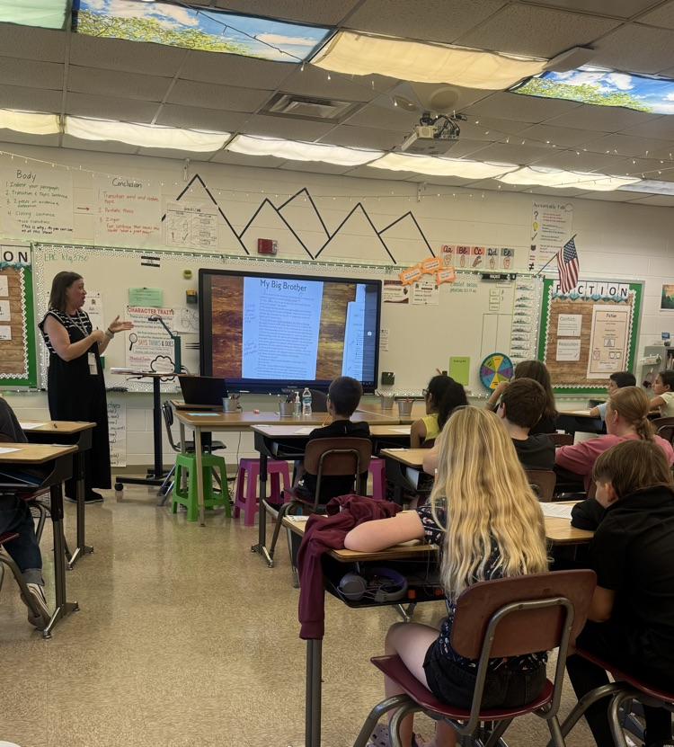 students in desks working 