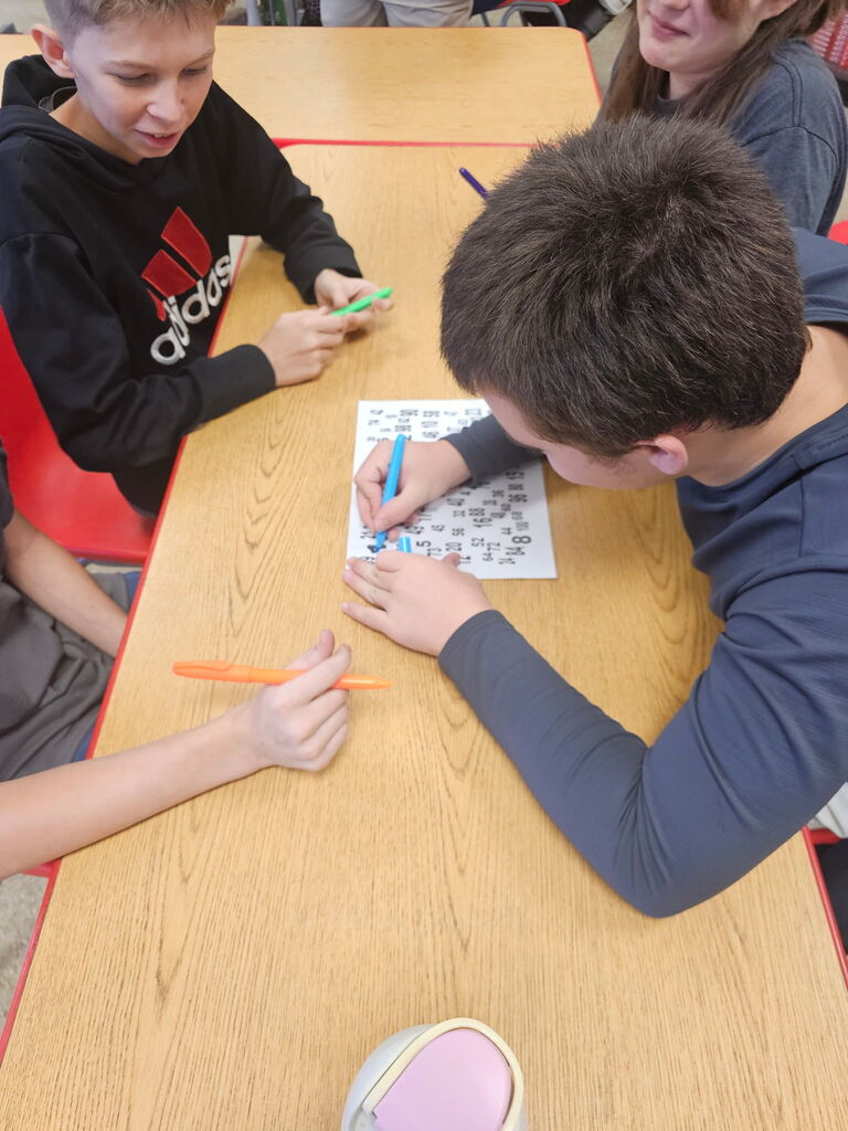 Students working together on team building activity.