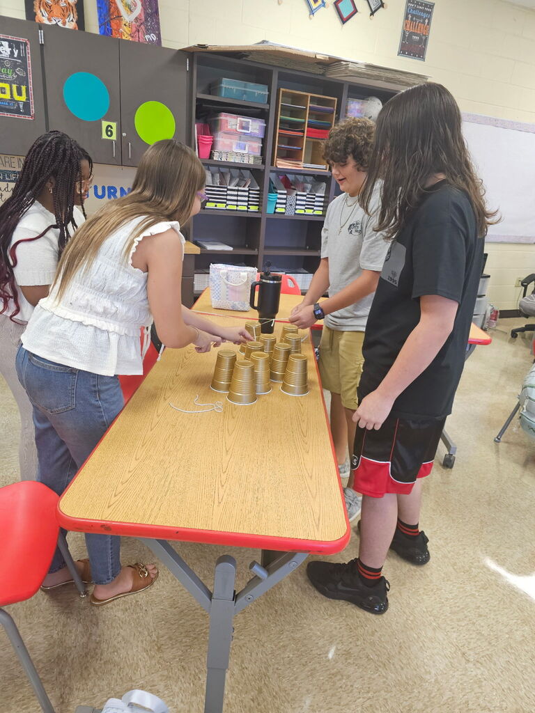 Students working together on team building activity.