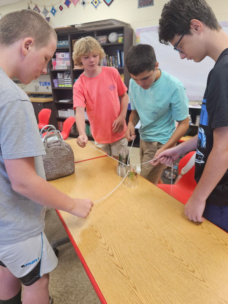 Students working together on team building activity.