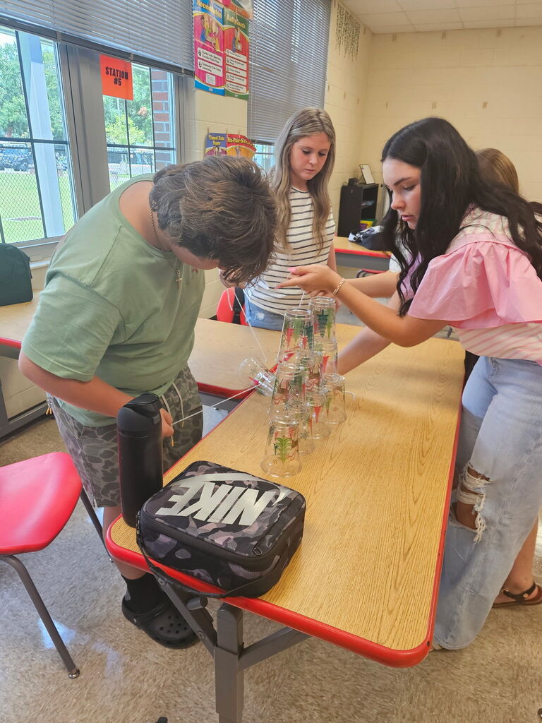 Students working together on team building activity.