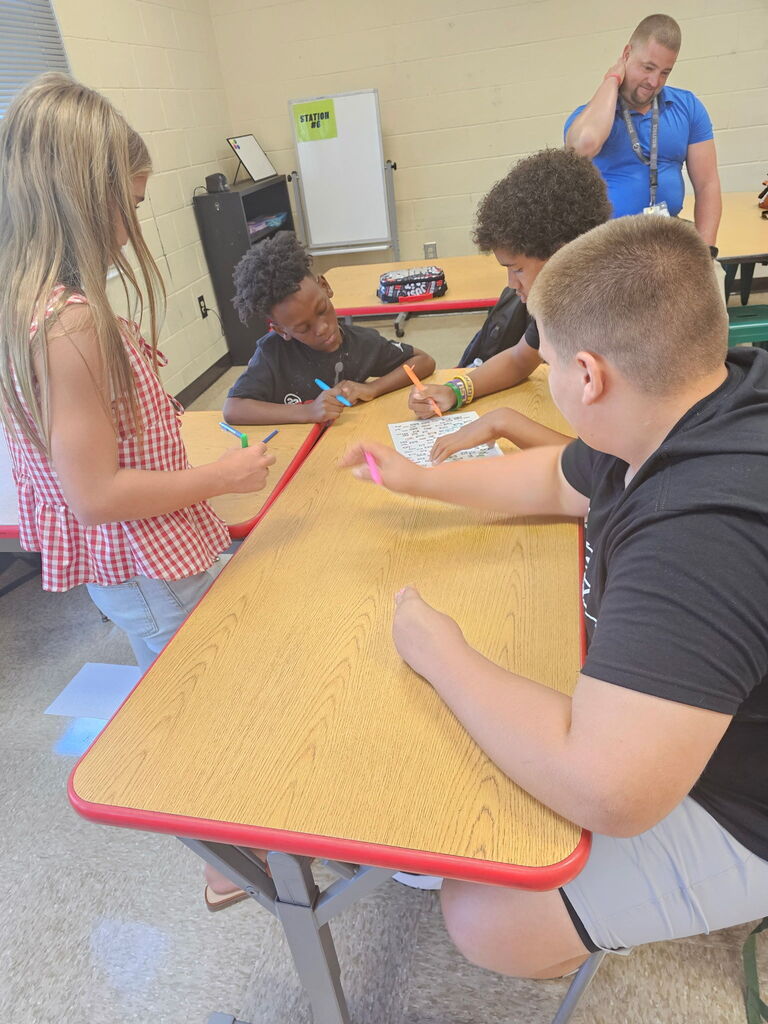 Students working together on team building activity.