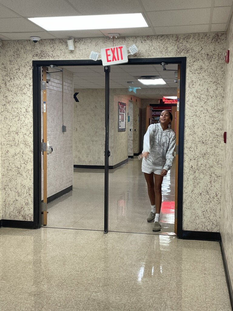 Students throwing paper airplane