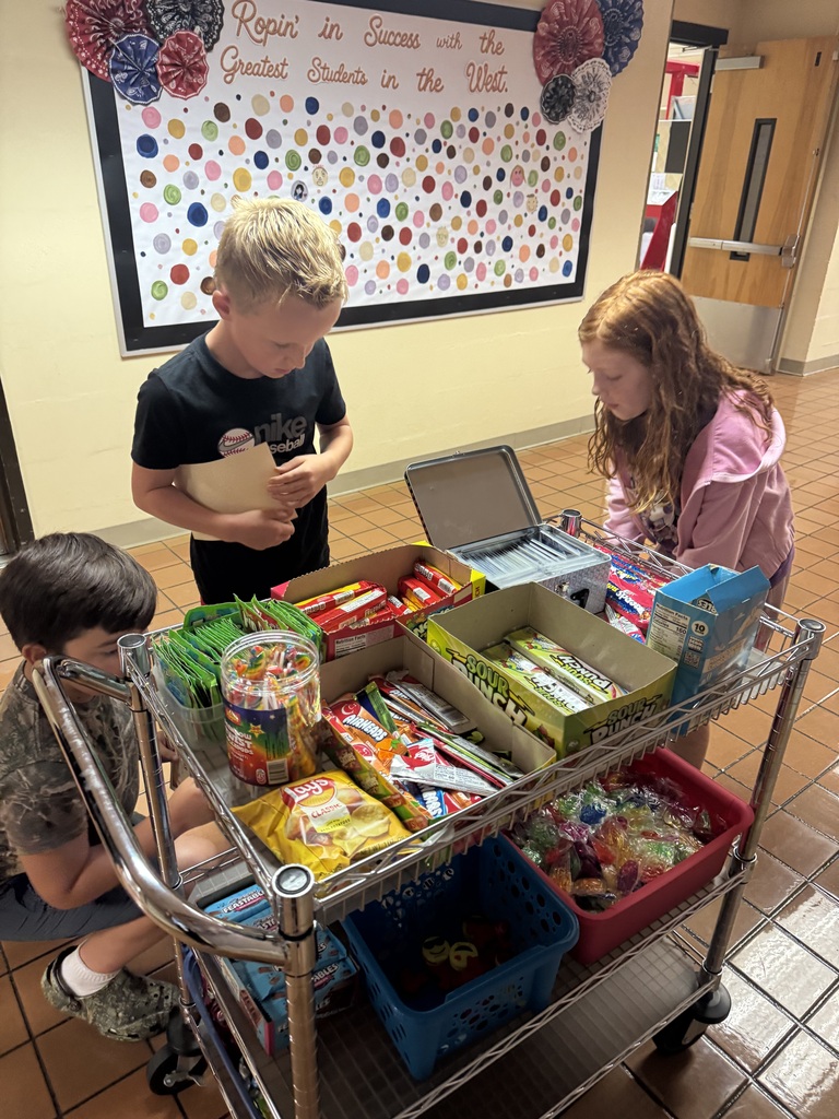Students look at all the possible Warrior Cart prizes they could choose from as a prize for being Respectful, Responsible, and Safe.