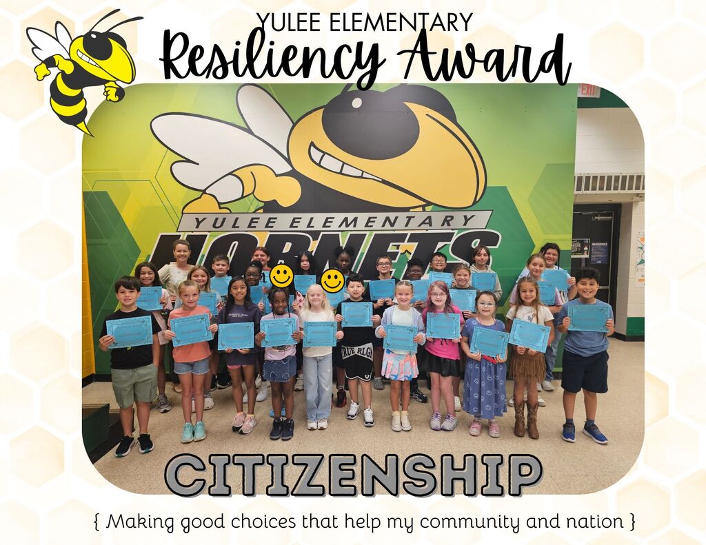 Yulee Elementary Resiliency Award for citizenship (Making good choices tat help my community and nation) students holding certificates in front of the yulee elementary hornet wall. 