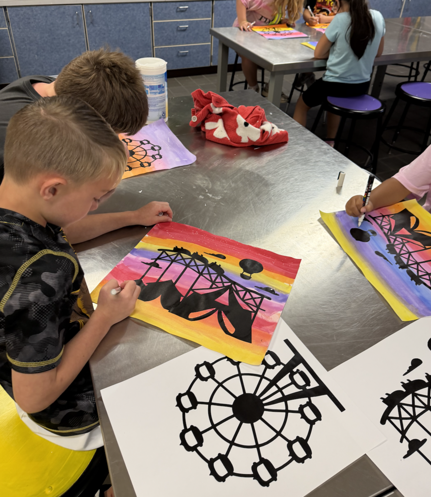 student painting in art class