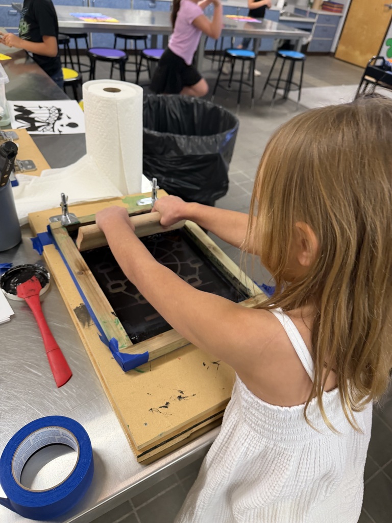 student screen printing in art class