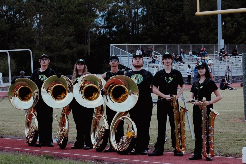 YHS tuba and saxophone players on football field