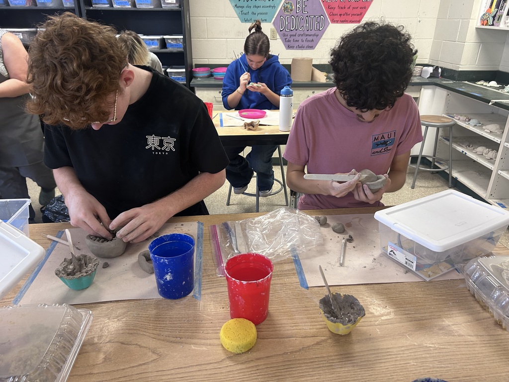 Students working with clay in ceramics