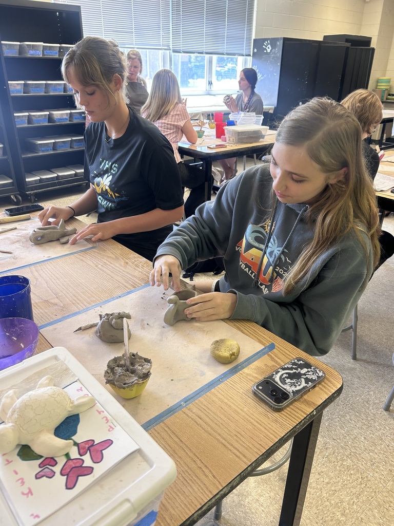 Students working with clay in ceramics