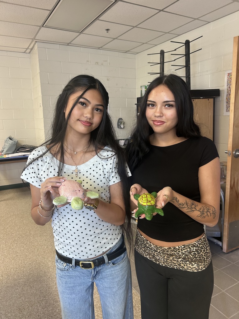 Ceramics students with their work