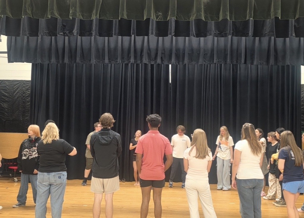 YHS Theatre students on stage, practicing