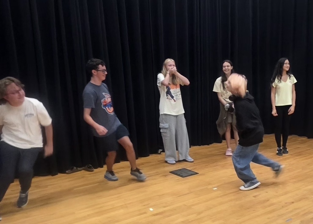 YHS Theatre students on stage, practicing