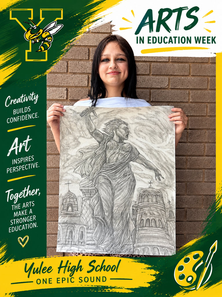 A student holding up her art work