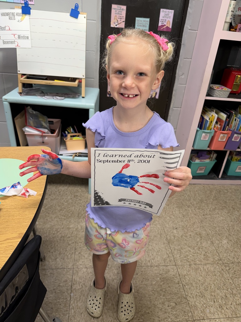 a student with at handprint craft