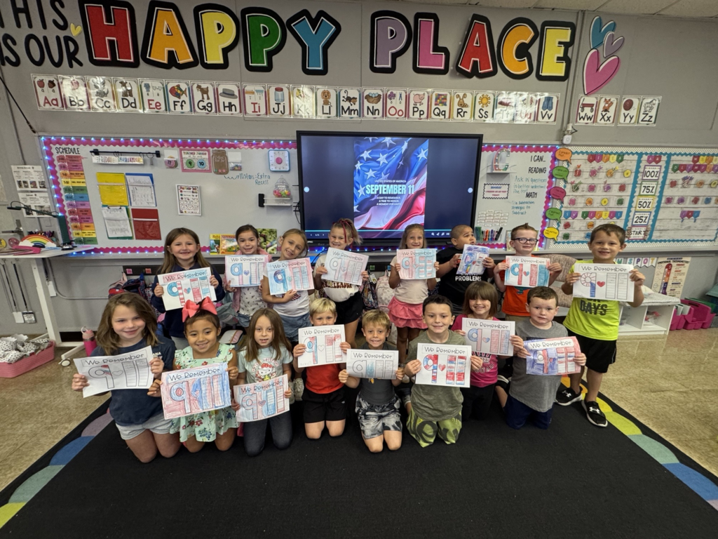 elementary students with a 9-11 craft