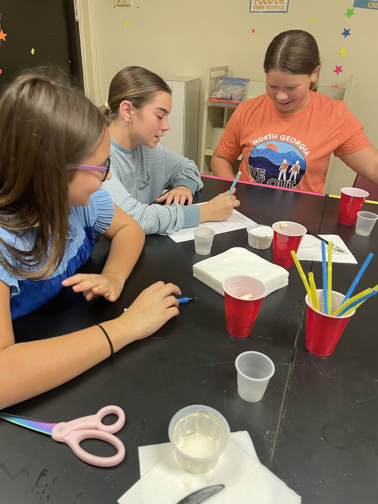 Mrs. Russell’s 8th grade science students are learning how matter exists in three forms—solids, liquids, and gases—and how each state differs in shape and volume.