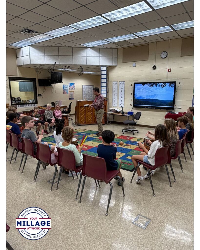 Students in the Music room playing musical instruments 