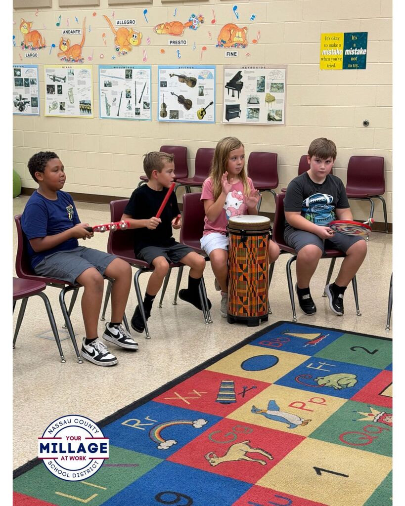 Students in the Music room playing musical instruments 