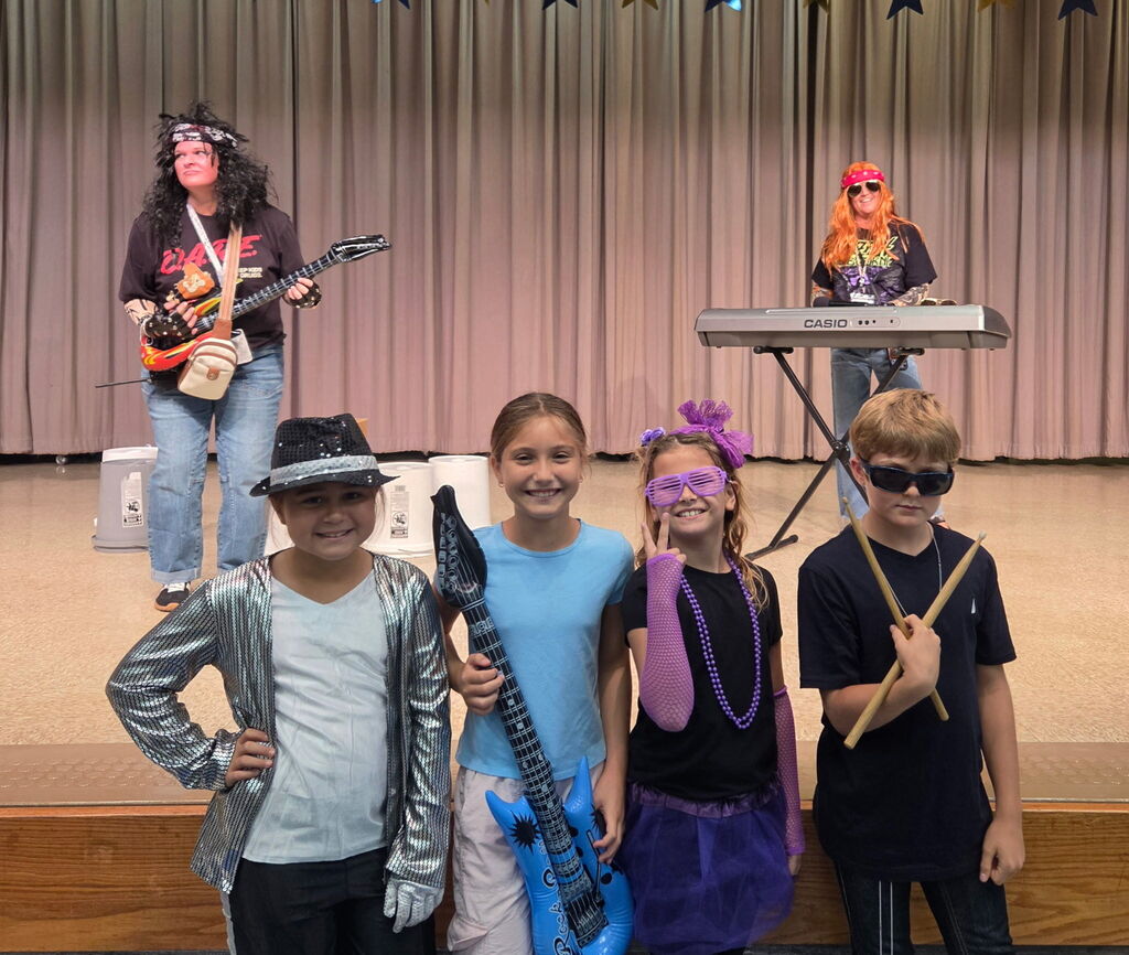 Students dressed up as a rock and roll singer/star.