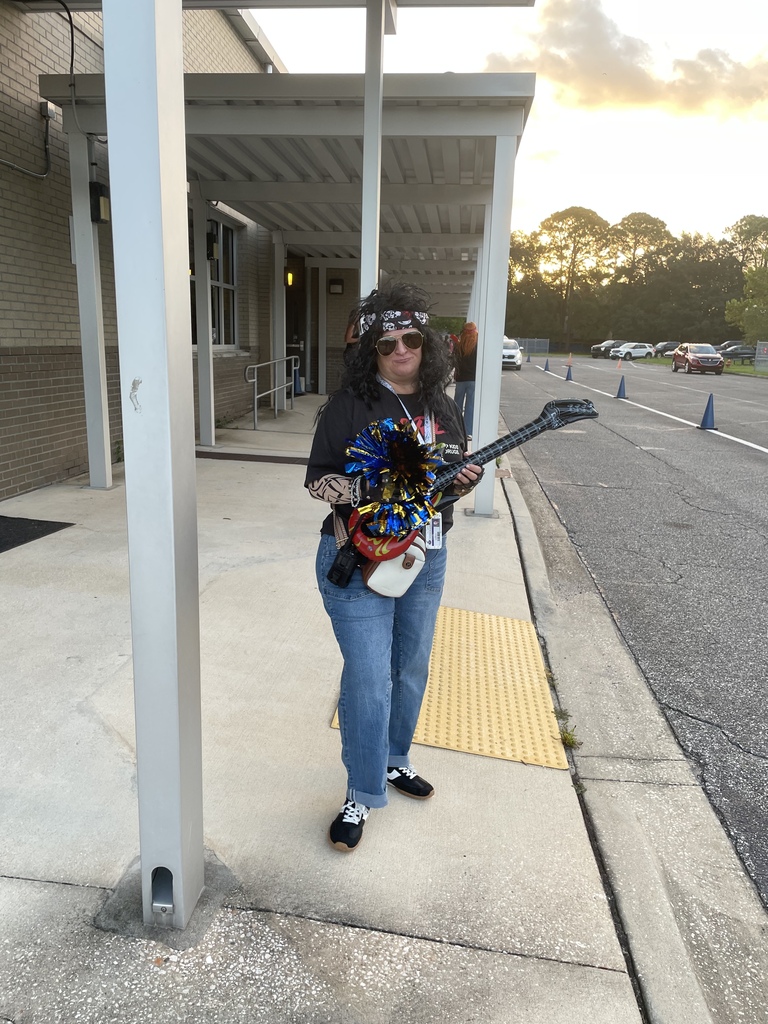 Ms. Domingo dressed up as a rock and roll singer/star.