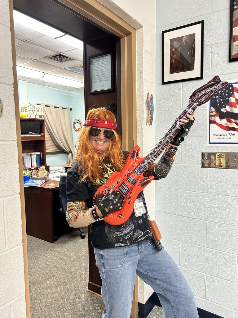 Ms. Smith dressed up as a rock and roll singer/star.