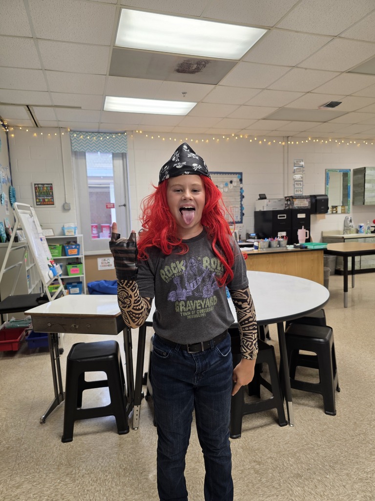Students dressed up as a rock and roll singer/star.
