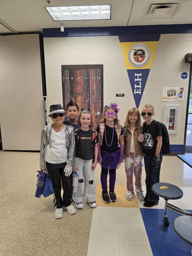 Students dressed up as a rock and roll singer/star.
