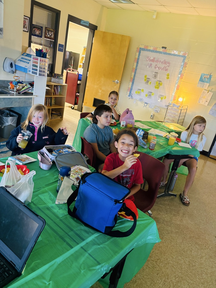 Students smile while enjoying books and special treats during their Starbooks reading experience. Reading is even sweeter when learning feels this fun! 
