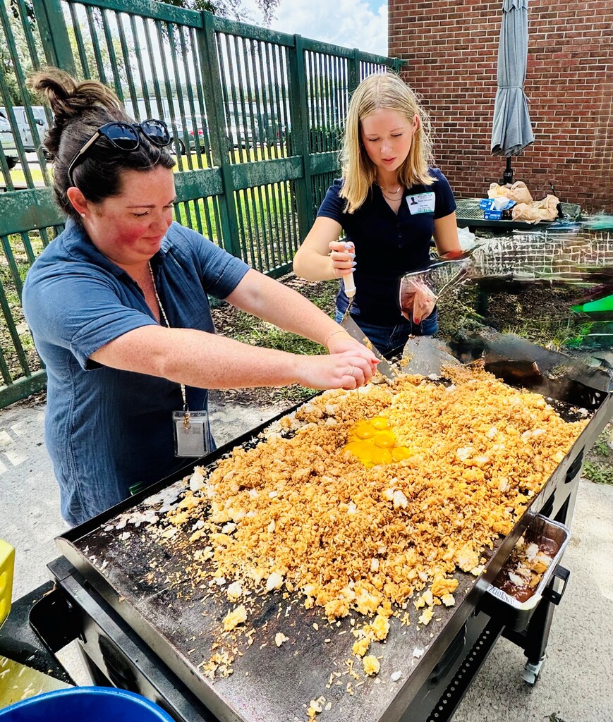 people cracking eggs in rice