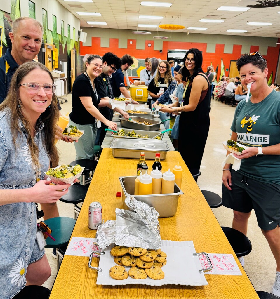 group of people waiting in line for food