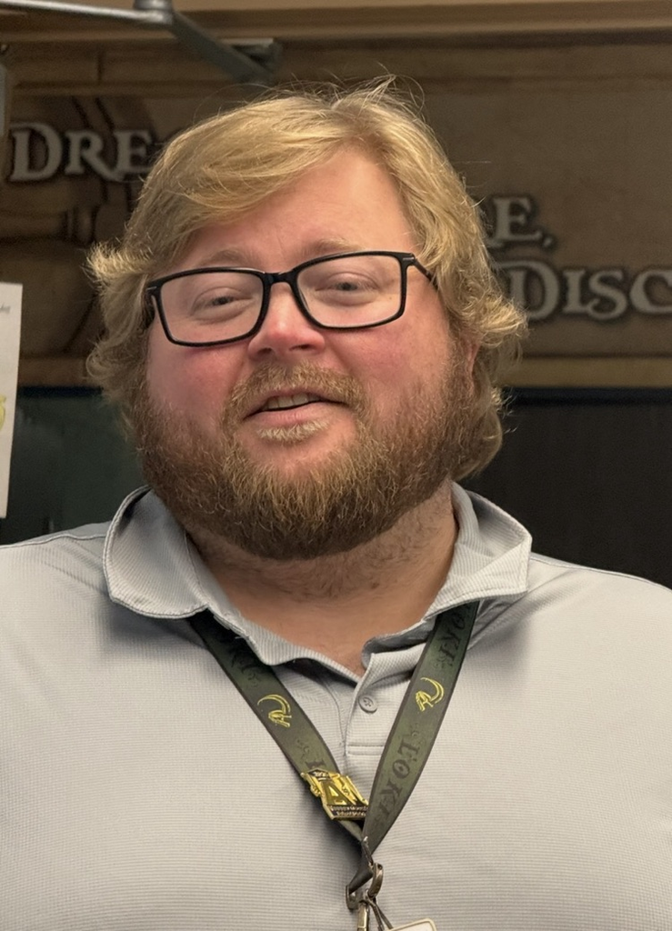 Mr. Humphrey’s headshot  a young man who is blond and is wearing glasses.  he is smiling. 