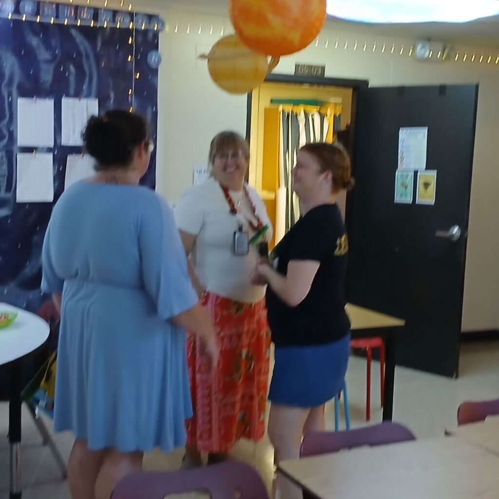 Parent speaking with Ms. Leonard and Ms. Cook