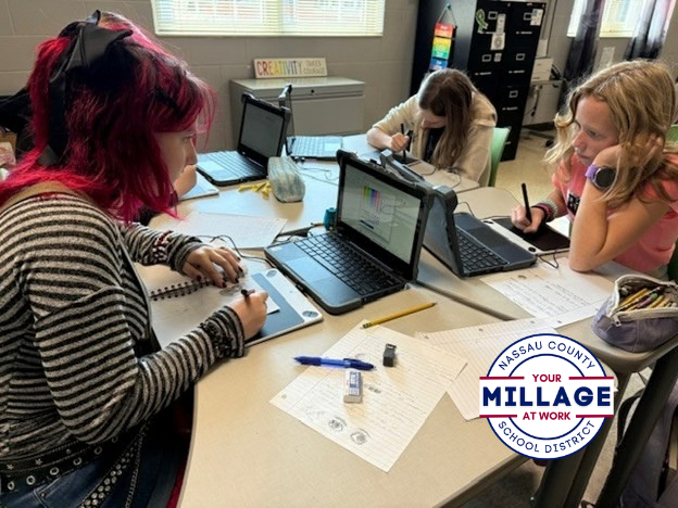 two students drawing a digital art project