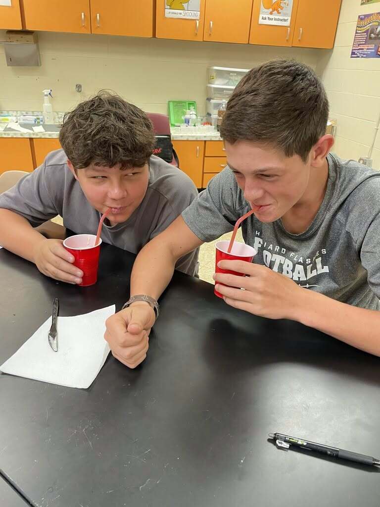 Two eighth-grade students at Hilliard Middle-Senior High School enjoy their root beer floats after completing a hands-on states of matter science lab.