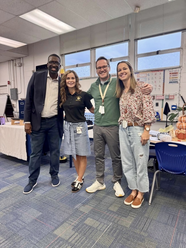 Picture of the principal, assistant princial, Mr. Blake, and Mrs. Blake.
