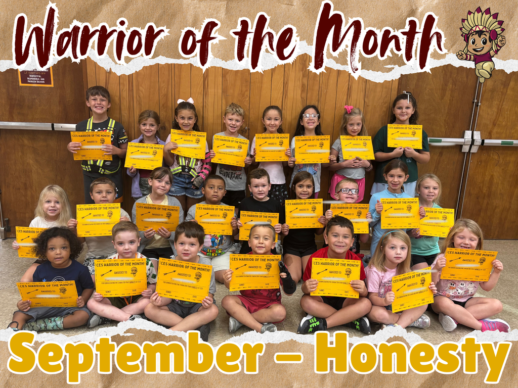 a group of students holding certificates for being recognized as Warrior of the Month for September for the Trait of Honesty