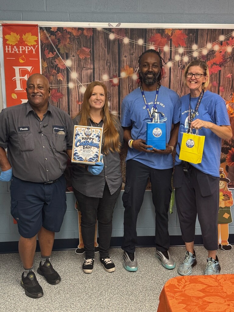 photo of the school's 4 custodians with their treat bags